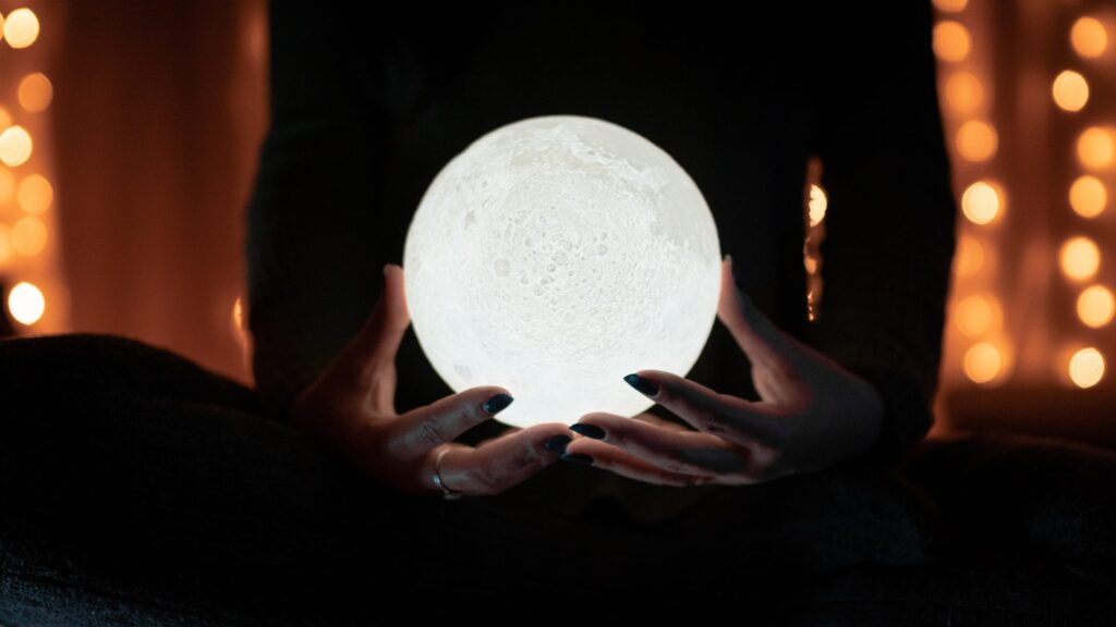 person holdong a sphere